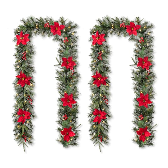 Glitzhome® 9ft. Pre-Lit Greenery Pine Poinsettia and Berries Christmas Garland with LED Lights and Timer